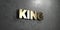 King - Gold sign mounted on glossy marble wall - 3D rendered royalty free stock illustration