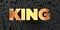 King - Gold text on black background - 3D rendered royalty free stock picture