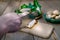 King Oyster Mushroom cutting on a wooden cutting board