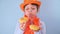 King's Day in Holland. Traditional festival on April 27 in the Netherlands. A little girl in a festive orange hat on a