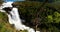 Kinsarvik, Hordaland, Norway. Waterfall Nyastolfossen In Hardangervidda Mountain Plateau. Nyastolsfossen in Spring Sunny