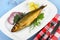 Kippers, smoked herring on a white plate with garnish
