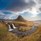 Kirkjufell in Iceland Kirkjufellsfoss waterfall and famous mountain under beautiful sunshine