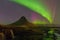 Kirkjufell mountain with beautiful northern lights and fully of star night view, Iceland