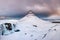 Kirkjufell mountain, Iceland. Kirkjufellsfoss waterfall. Winter landscape. Snow and ice.