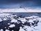 Kirkjufell mountain, Iceland. Winter landscape. The mountain and the ocean. Snow and ice.