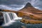 Kirkjufell mountain and Kirkjufellfoss waterfall, Snaefellsnes peninsula, Iceland. Long exposure shot in autumn