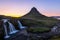 Kirkjufell mountain and Kirkjufellsfoss waterfall at sunset