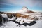 Kirkjufell waterfall with mountain in winter, at Iceland