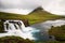 Kirkjufellfoss and Kirkjufell mountain in cloudy day ,Iceland.