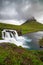 Kirkjufellfoss and Kirkjufell mountain in cloudy day ,Iceland