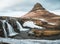 Kirkjufellsfoss and Kirkjufell Icelandic, Church mountain , a 463 m high mountain on the north coast of Iceland`s