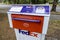 Kirkland, WA USA - circa September 2021: Angled view of a FedEx package and letter deposit station in downtown Kirkland