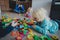 Kis play at home with toys scattered all over and tired exhausted father