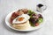 Kiseki Pancake with Maple Bacon and Fried Egg in white plate on grey background