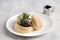 Kiseki Pancake with Matcha and Azuki Bean Paste in white plate on grey background