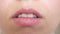 Kiss lips close-up. Beautiful smile of a young woman. Girl smiling teeth and lips close-up.
