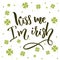Kiss me, I`m irish. Funny St. Patrick`s day quote for t-shirts and cards at four-leaf shamrock background.