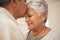 Kiss, smile and senior couple in home with love, support and commitment to marriage in retirement. Embrace, face of