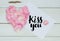 Kiss you message with heart from rose petals and Lipstick kiss