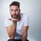 Kisses coming your way. Portrait of a sweet young man blowing a kiss in studio.