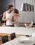 Kissing couple in the kitchen in the morning