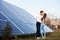 Kissing couple near solar panel