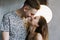 Kissing couple portrait. Young couple deeply in love sharing a romantic kiss, closeup profile view of their faces