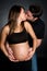 Kissing Pregnant Couple