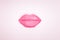 Kissing woman lips shine pink colored on paper background. Close up glamour kiss 3d volume paper object