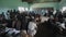 KISUMU,KENYA - MAY 21, 2018: Group of Caucasian volunteers at small school in Africa. Children listen in a classroom.