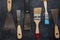 Kit of rusty old putty knives and brushes for repair and decorative works