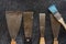 Kit of rusty old putty knives and brushes for repair and decorative works