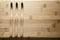 Kit of toothbrushes on the rustic wooden table in the bathroom. Warm and welcoming atmosphere.