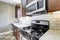 Kitchen area with marble tops and tile back splash trim