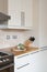 Kitchen with chopping board knife block, cooker & hood