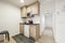 Kitchen with dark gray countertops, wood cabinets, and built-in