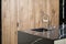 Kitchen faucet, modern kitchen in loft style, black marble table, wooden luxury kitchen