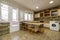 Kitchen furnished with a matching peninsula with low wooden stools