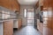 Kitchen furnished with wood-colored furniture and granite countertops