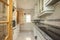 Kitchen with granite countertops, marble-like tiled floors and large