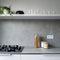 Kitchen with gray countertop and backsplash