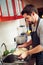 The kitchen is his happy place. a young man rinsing pasta at home.