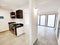 Kitchen of a house with marble pots and electric oven and glass windows