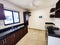 Kitchen of a house with marble pots and electric oven and glass windows