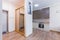 Kitchen interior in gray studio with corridor and stairs