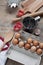 Kitchen items Metal Utensils Spoon Eggs on a wooden table. Cooking Baking Eggs Groceries Top View