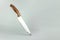 Kitchen knife balanced on its end. Creative layout. Chef, restaurant or kitchen concept