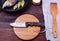 Kitchen knife on a circular cutting wooden board