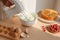 Kitchen mixer whips cream to make sponge cake or red velvet cake